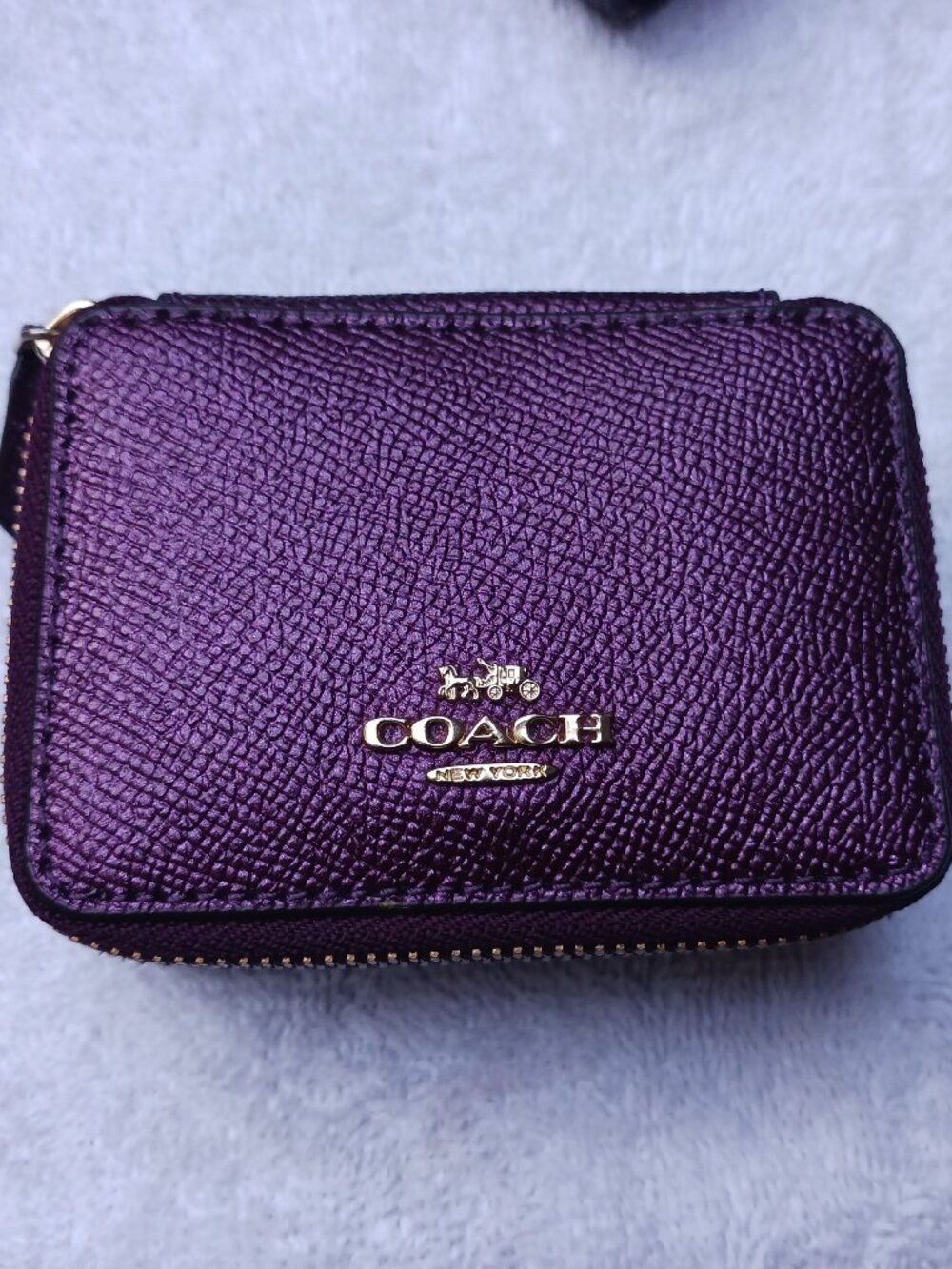 Purple Coach leather zip-around travel jewelry/pill case